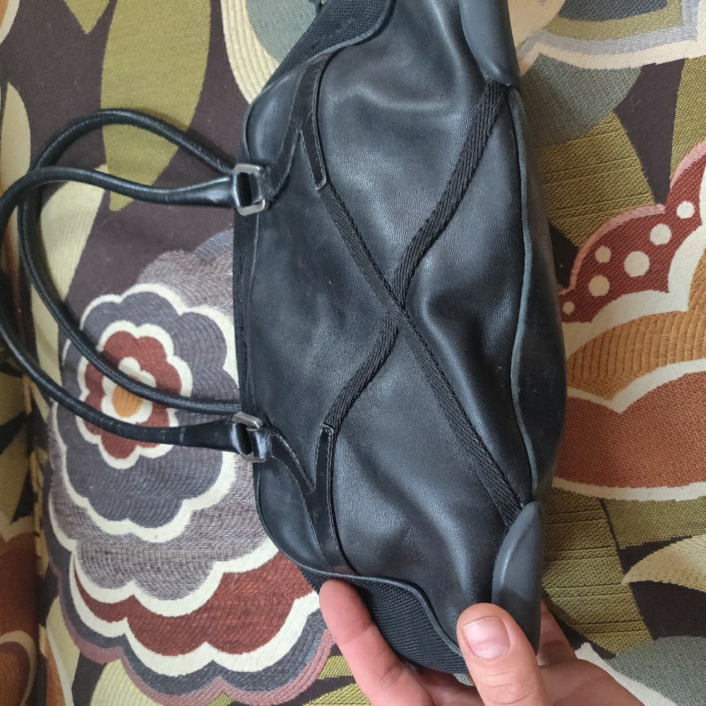 Small black prada bag; repaired.